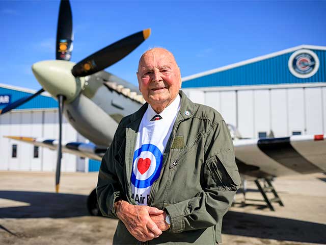 RAF veteran in front of plane.